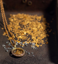 Load image into Gallery viewer, Image of gold locket pendant, diamonds and natural gold flakes sitting in an old miners shovel
